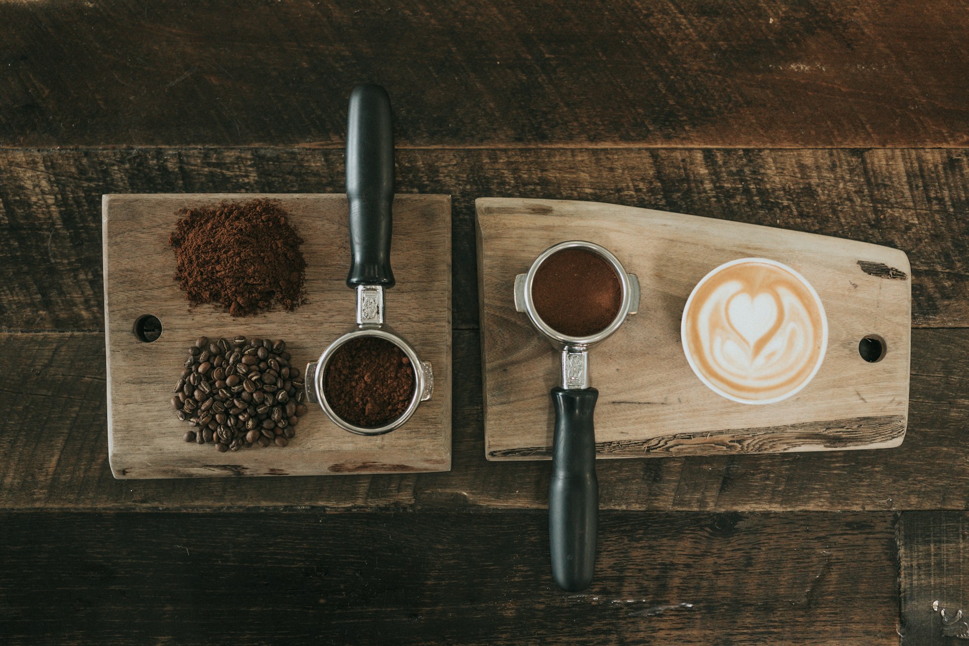 Cinematic shot of freshly roasted dark brown coffee beans spilling out of a rustic burlap sack onto a dark wooden table